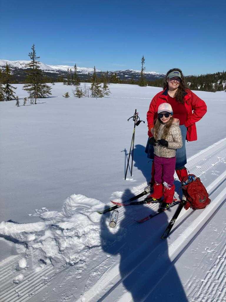 The family in a sea of white snow and sunlight